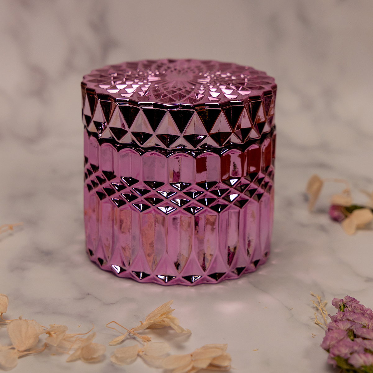 pink geometric candle vessel with a lid